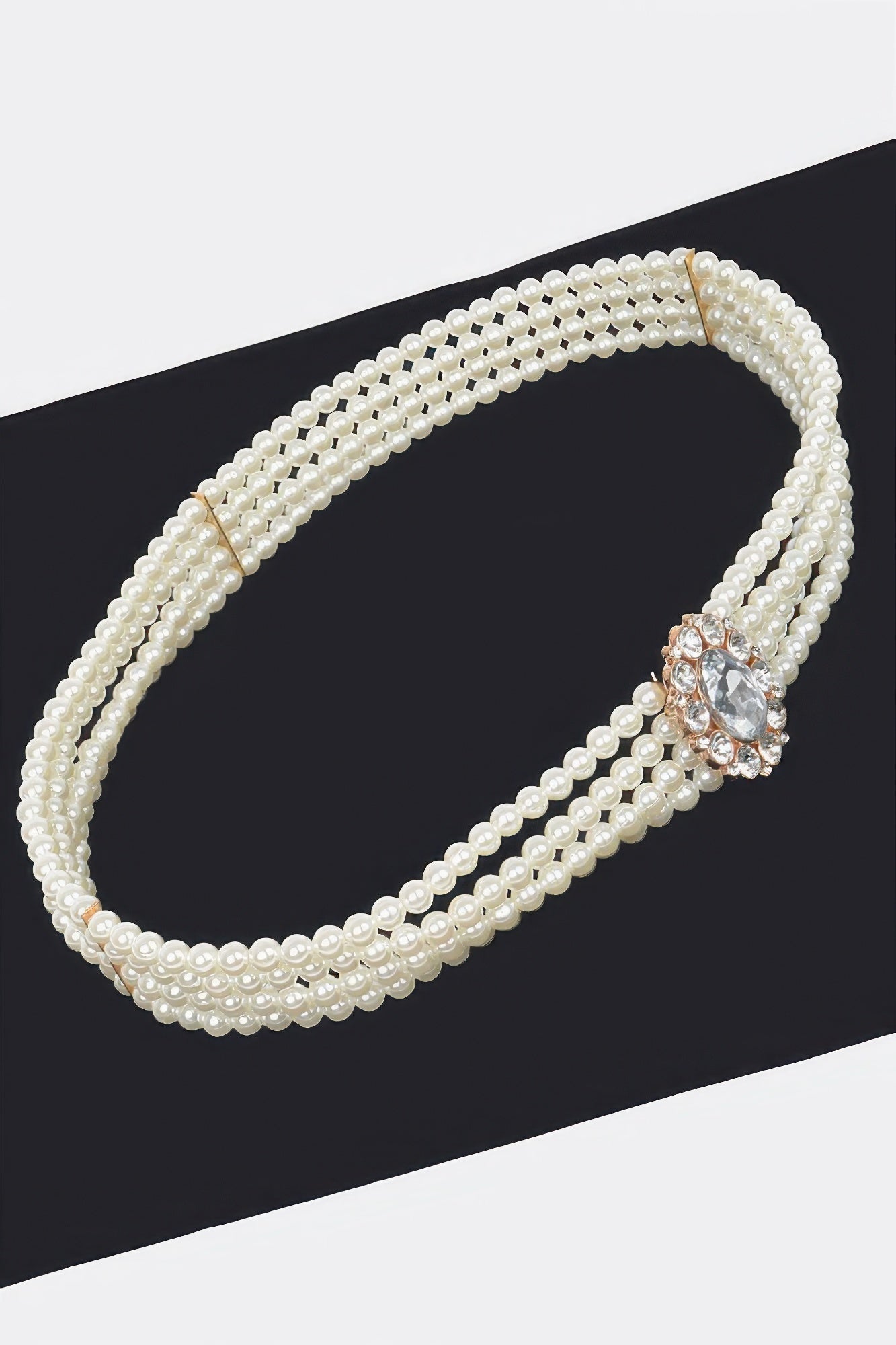 Faux pearl cord belt with rhinestone oval ornament, double-loop design