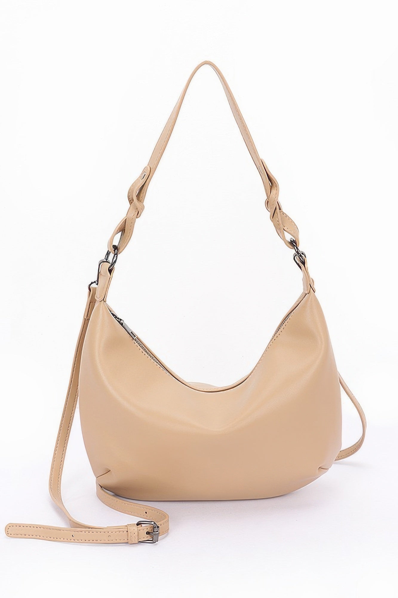 Beige faux leather shoulder bag with adjustable crossbody strap and buckle