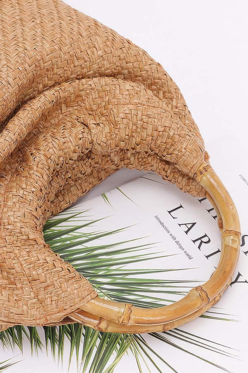 Camel faux straw bag with curved bamboo handle and woven pattern