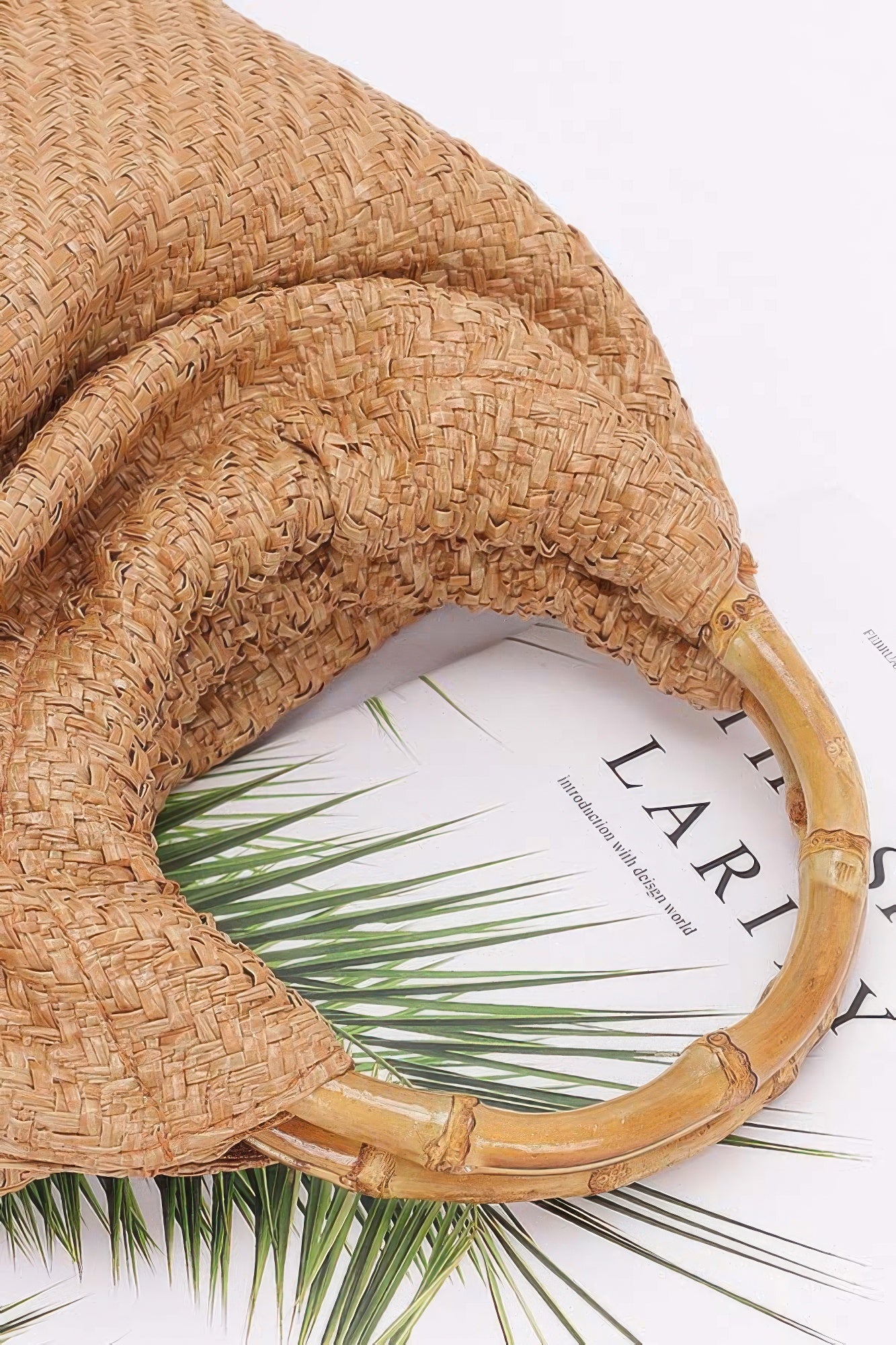Camel faux straw bag with curved bamboo handle and woven pattern