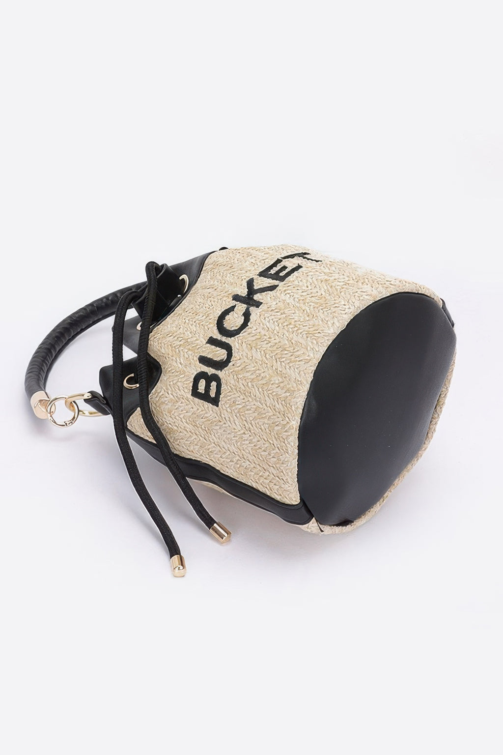 Faux straw bucket bag side view, camel woven texture with black faux-leather trim