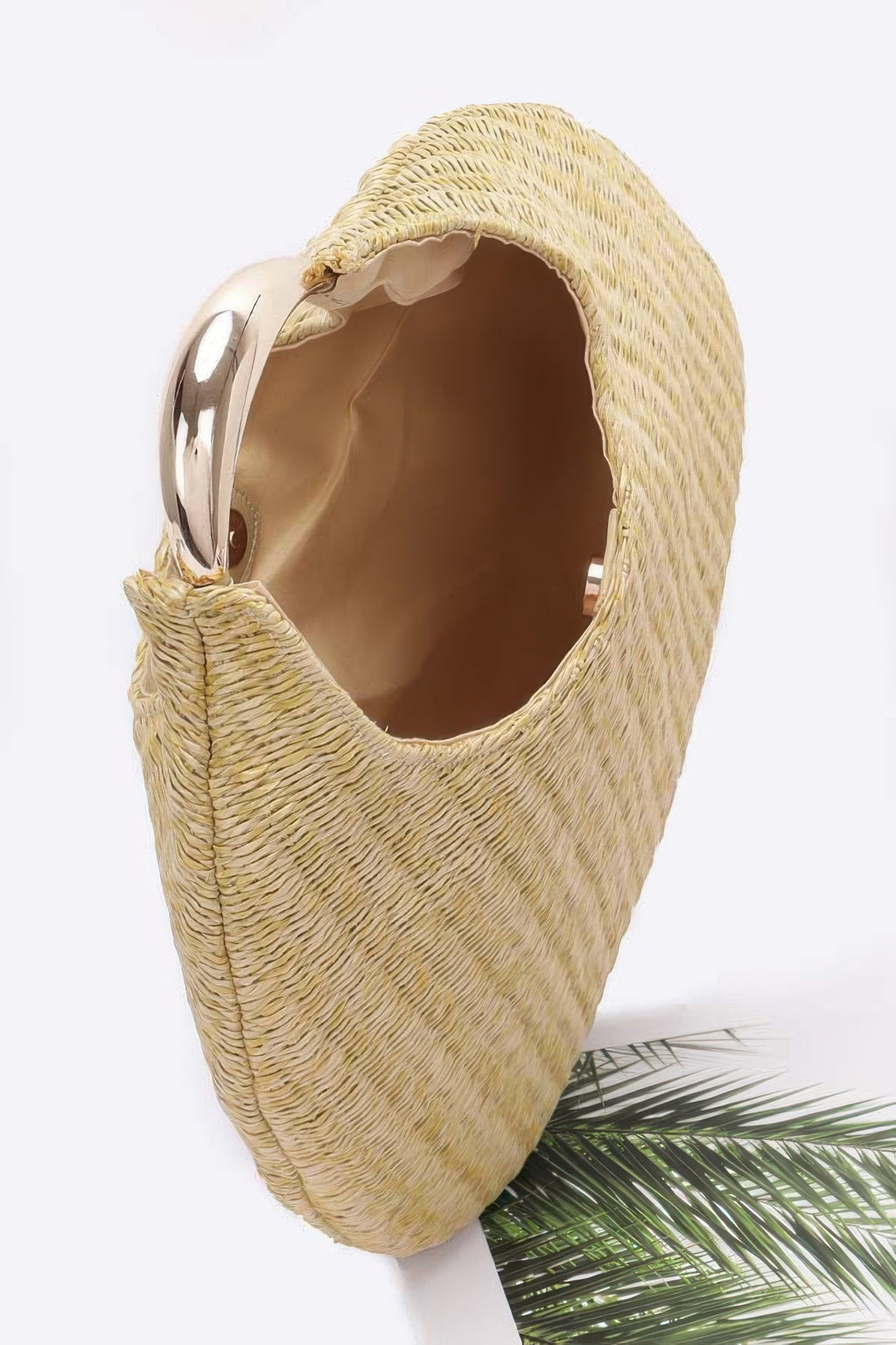 Inside view of khaki faux straw hobo bag with metal handle