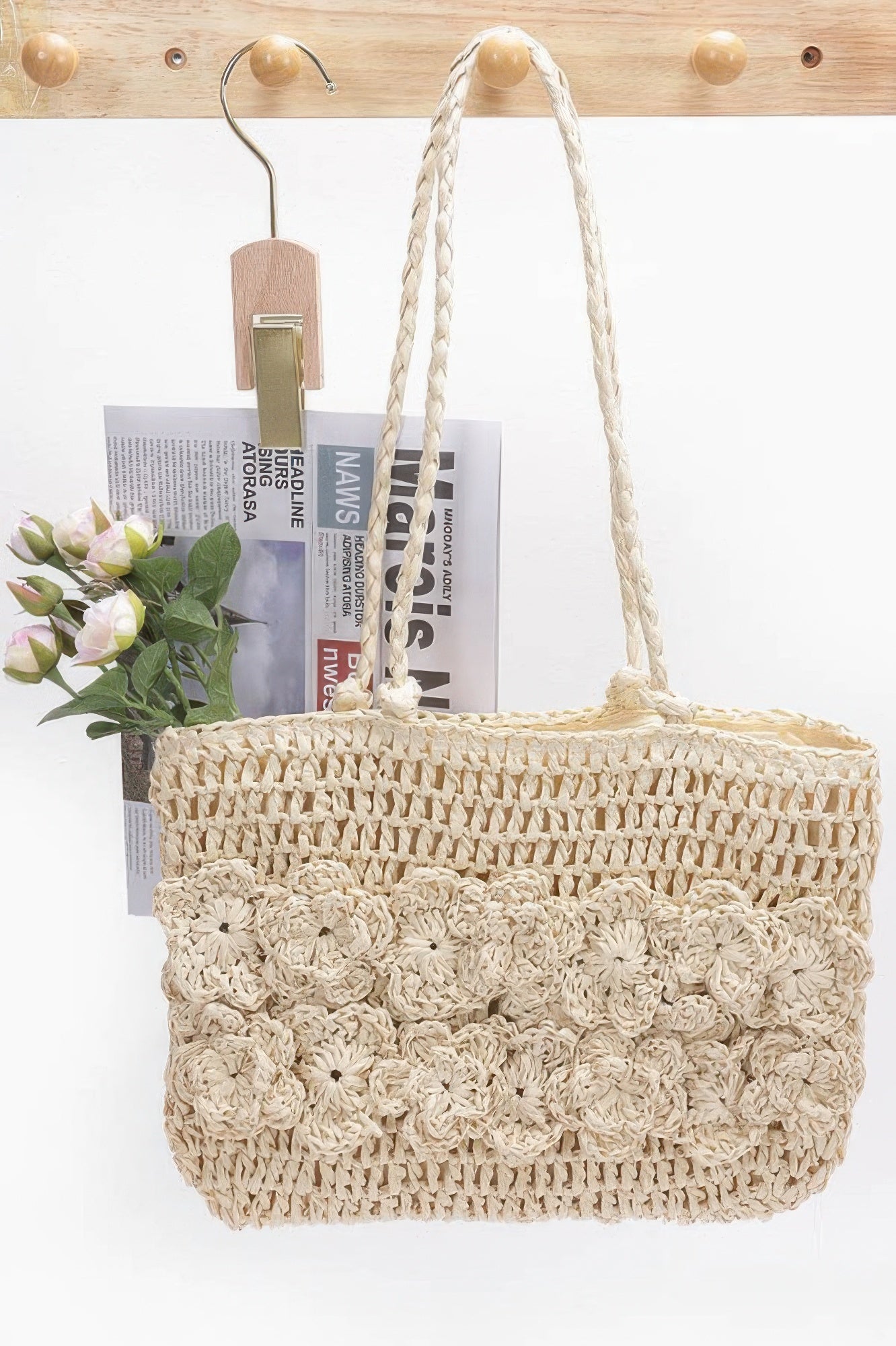 Faux straw tote bag in ivory with crochet flower front panel and braided handles