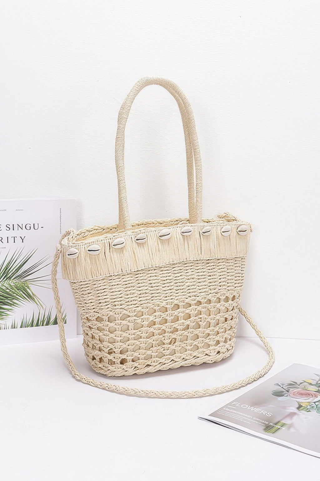 Ivory faux straw shell tote bag with rope handles and frayed top trim