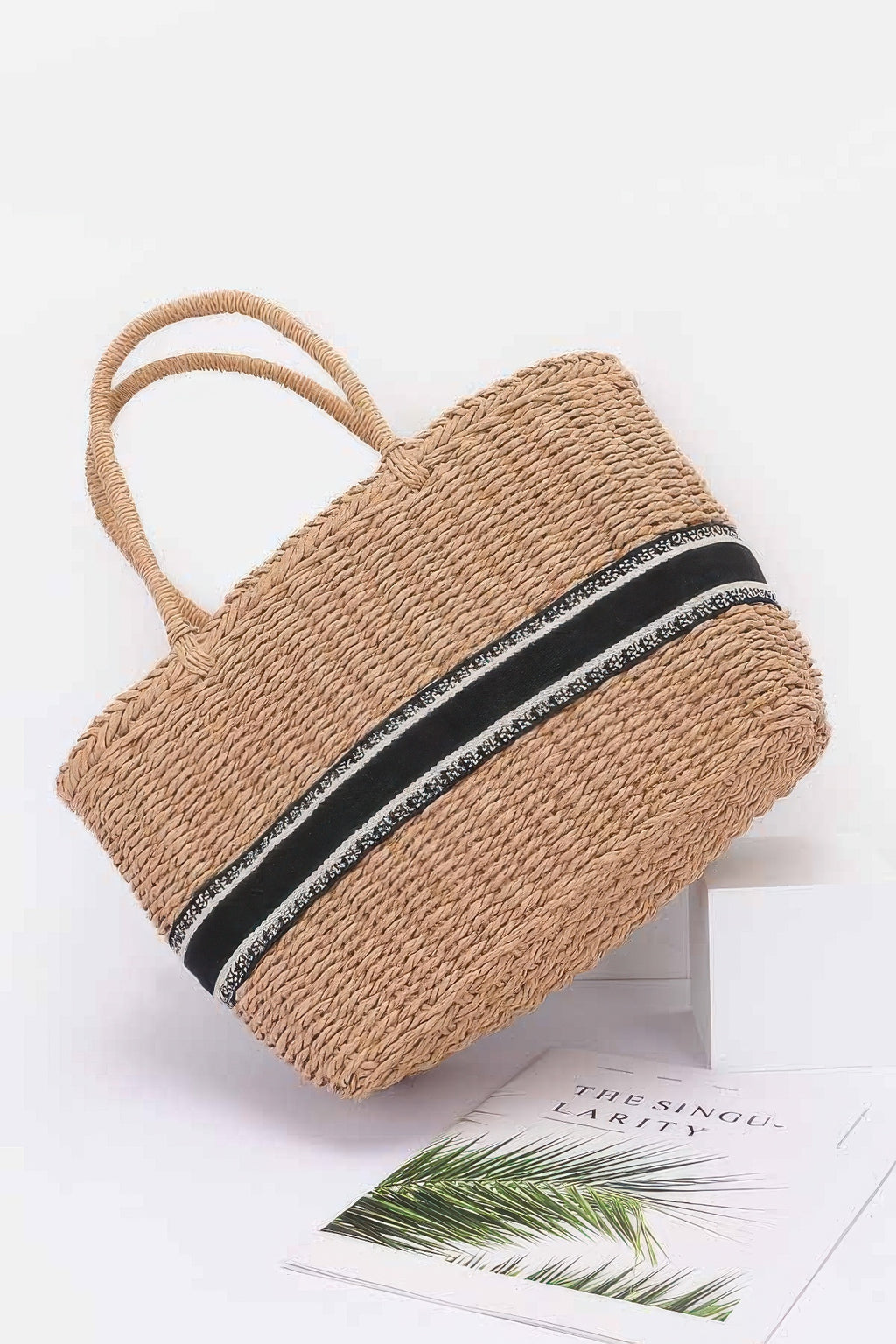 Khaki faux straw tote bag, angled side view with striped band