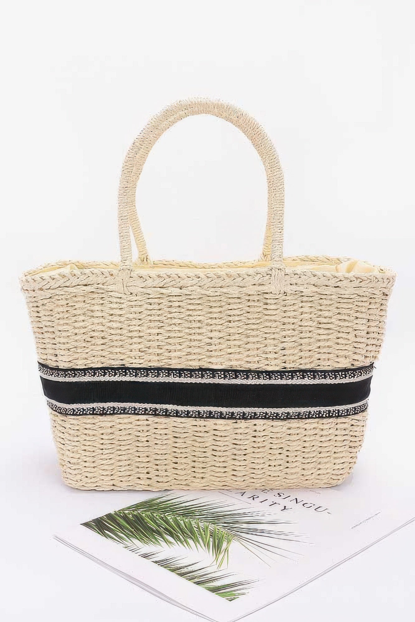 Ivory faux straw tote bag with black-and-white striped band and rope handles