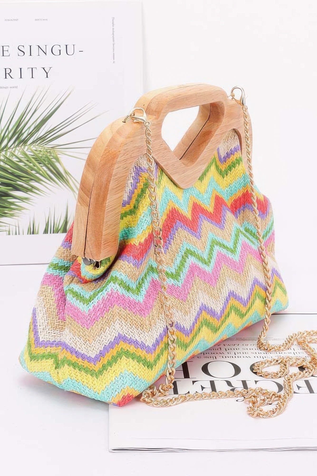 Faux straw wood-frame clutch, side view with chain strap, multicolor zigzag