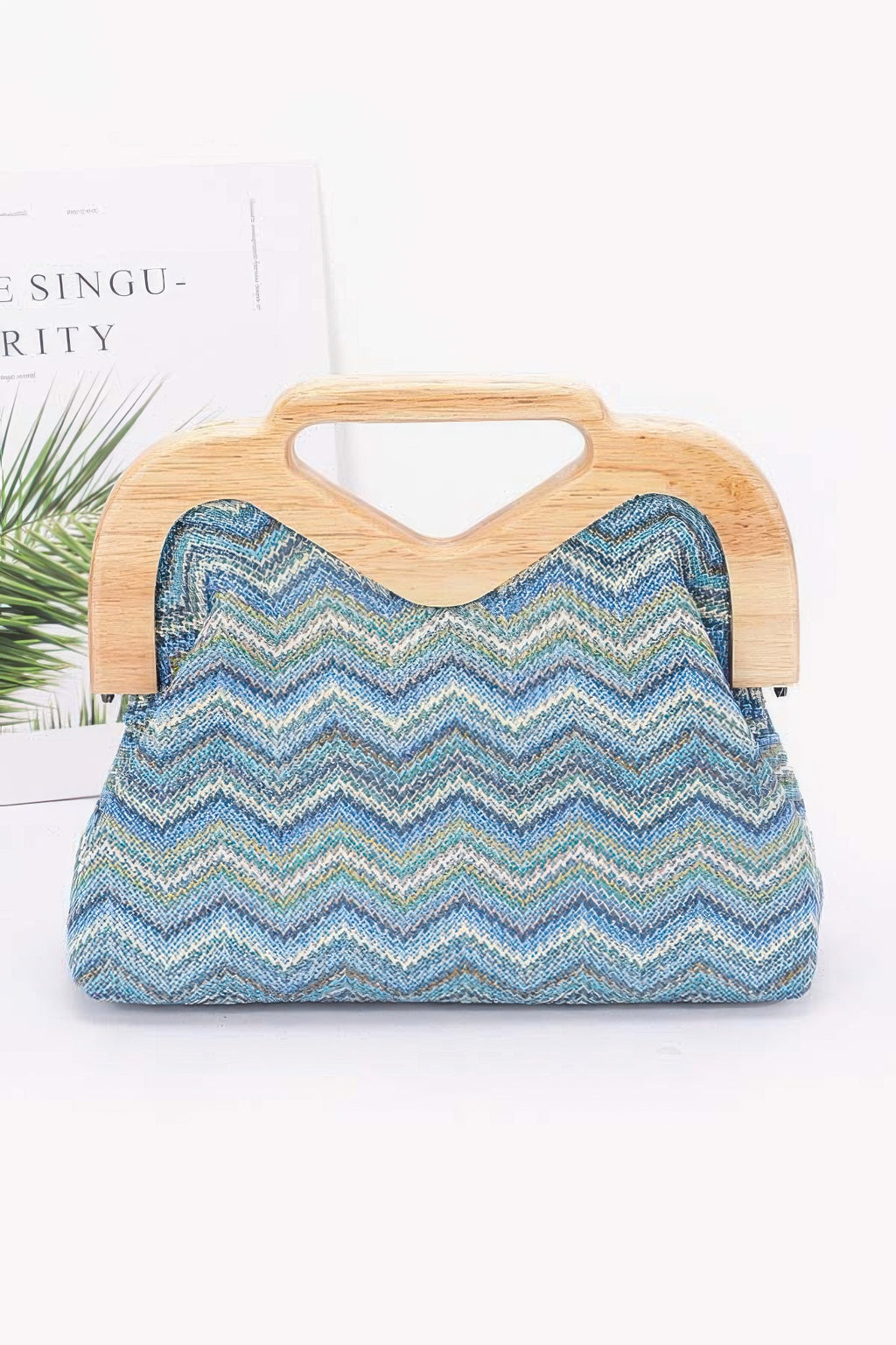 Faux straw wood-frame clutch with zigzag chevron fabric, blue