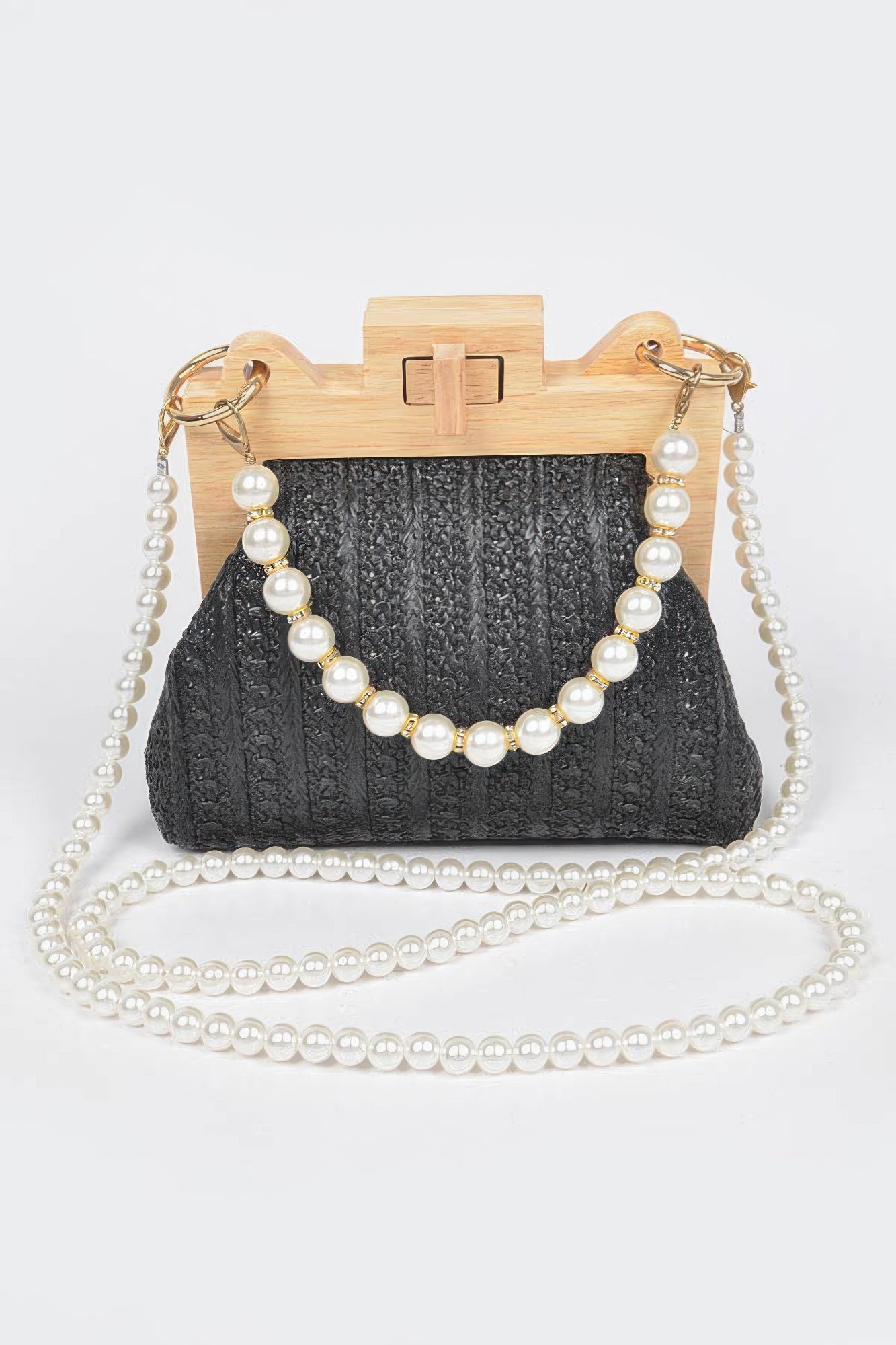 Black faux straw clutch with wood frame, faux pearl chain handle, and pearl tassel clasp