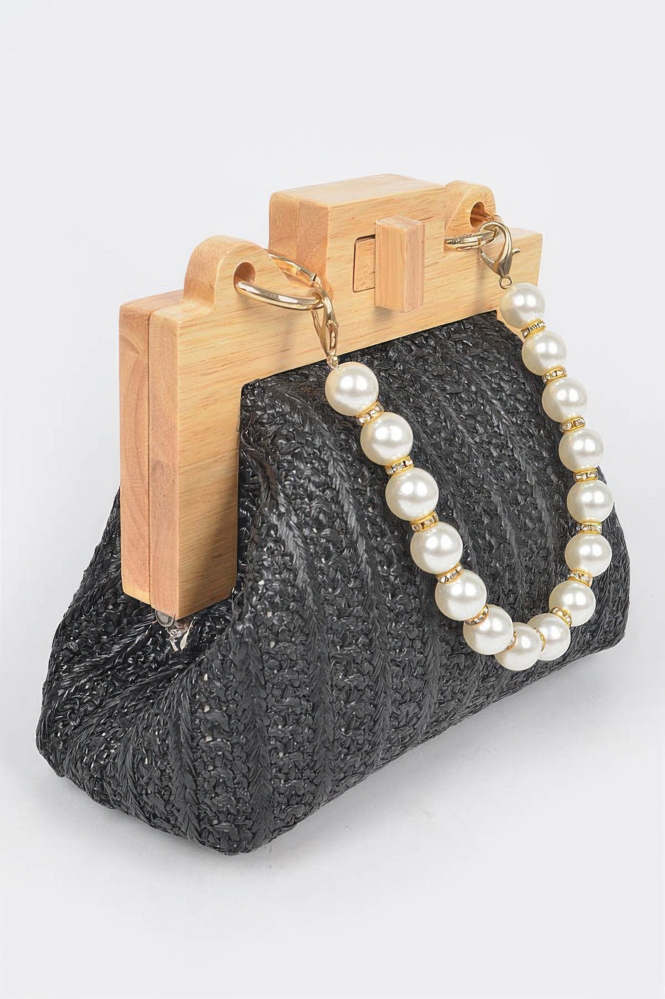 Black faux straw clutch close-up with wood frame and layered faux pearl bead chain