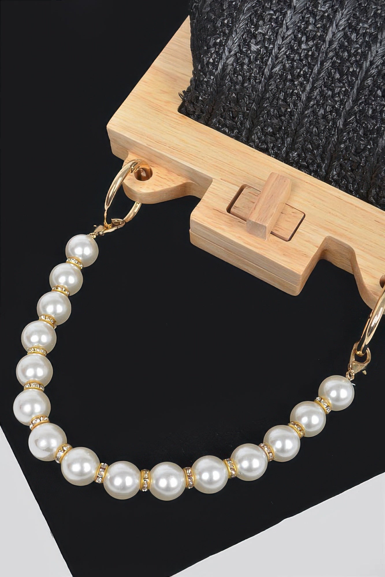 Faux pearl bead chain for clutch with gold-tone links and wood clasp hardware detail