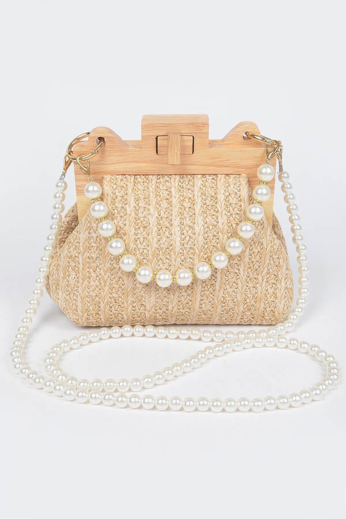 Beige faux straw clutch with wood frame and faux pearl chain handle with pearl accents