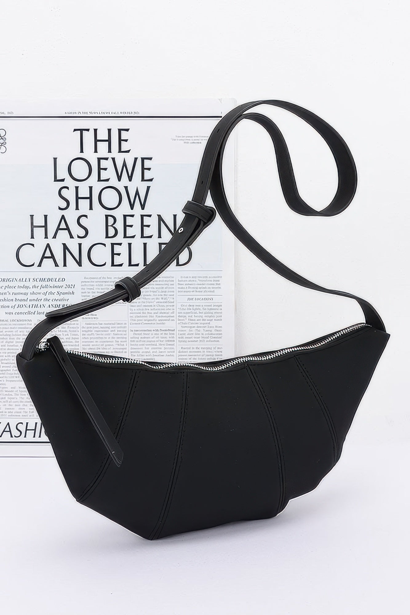 Faux Suede Croissant Bag in Black with zip-top opening and shoulder strap
