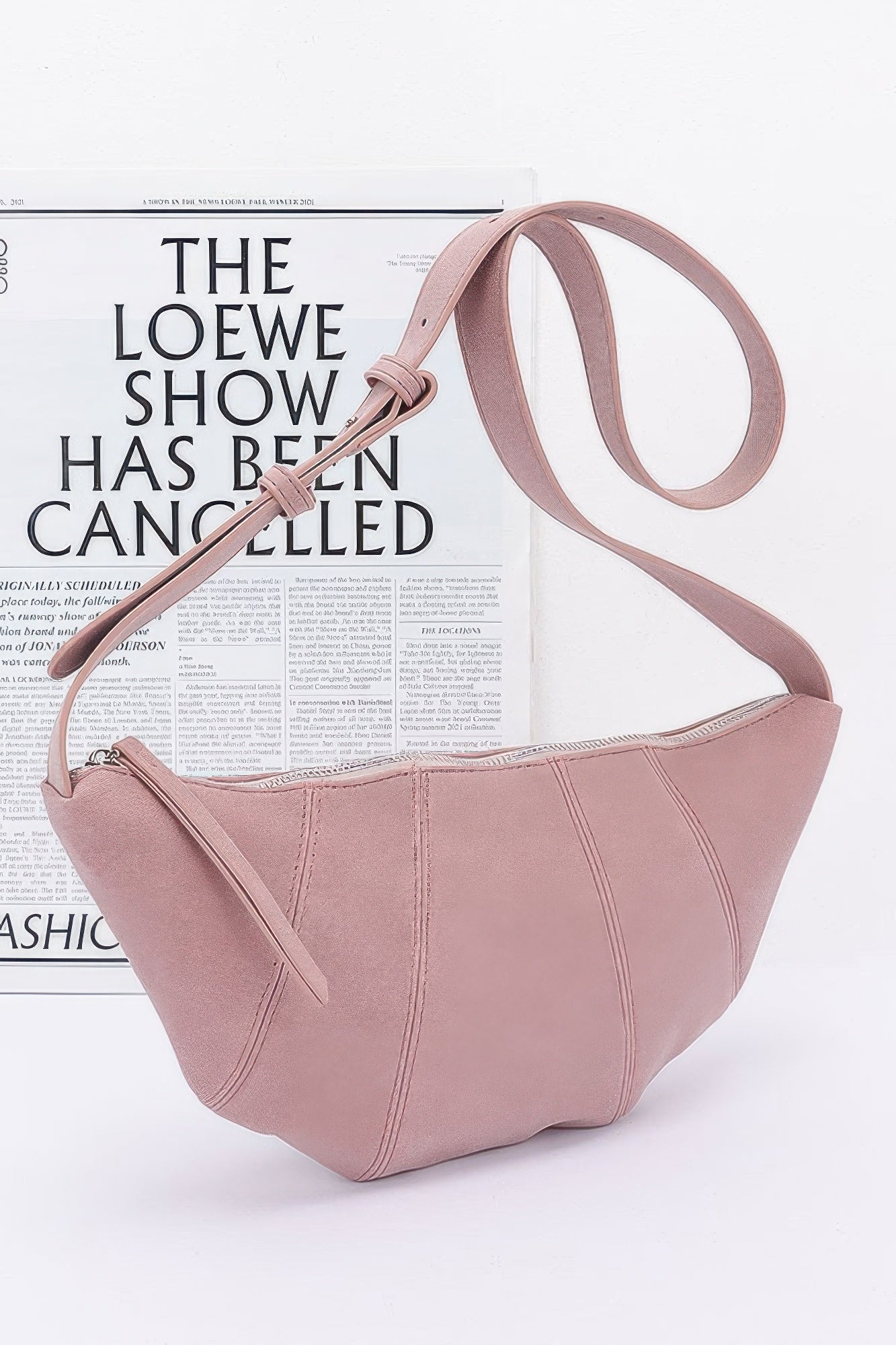 Faux Suede Croissant Bag in Pink with long shoulder strap and crescent front