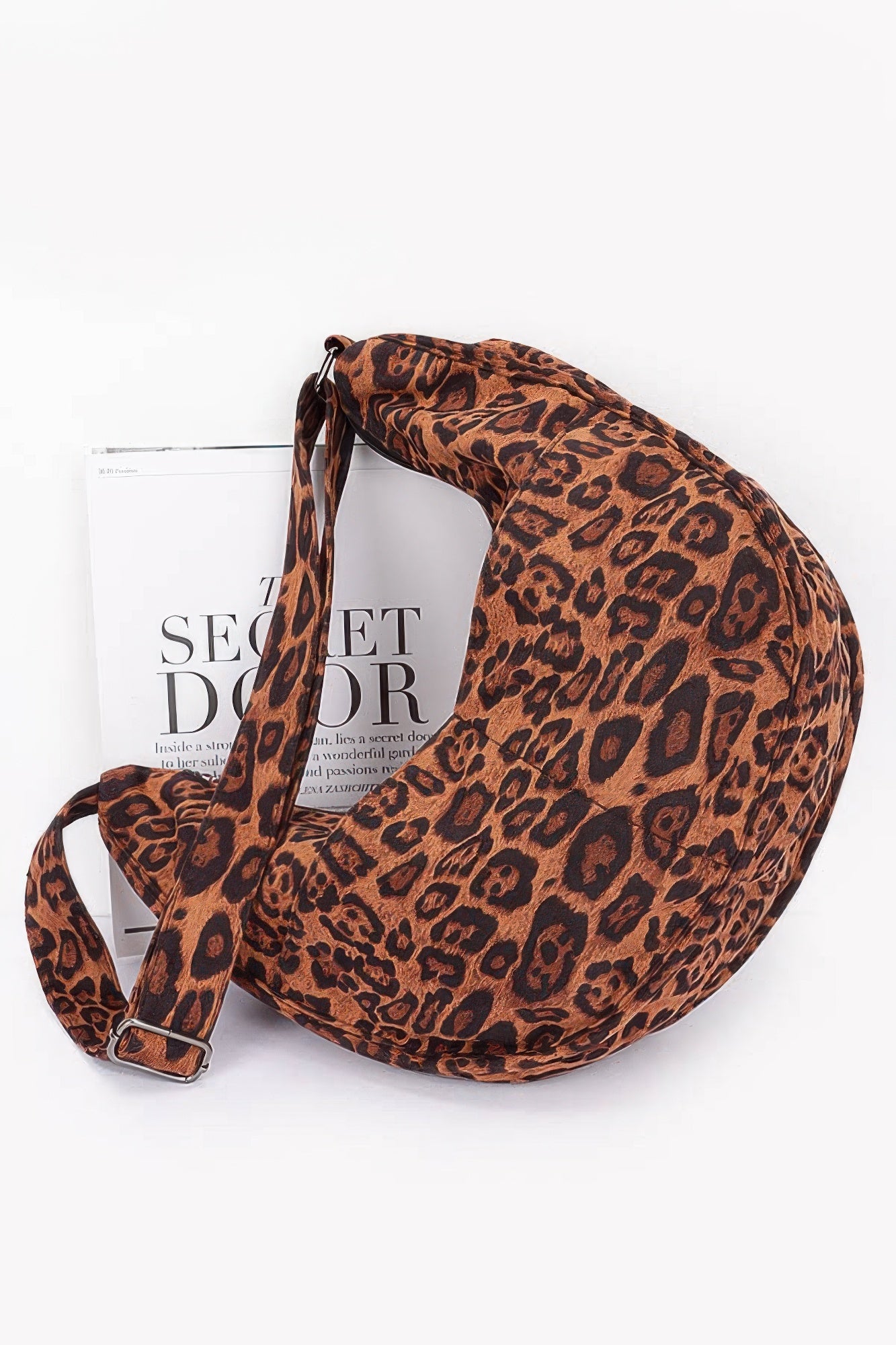 Leopard faux suede crossbody bag, round hobo silhouette, adjustable strap