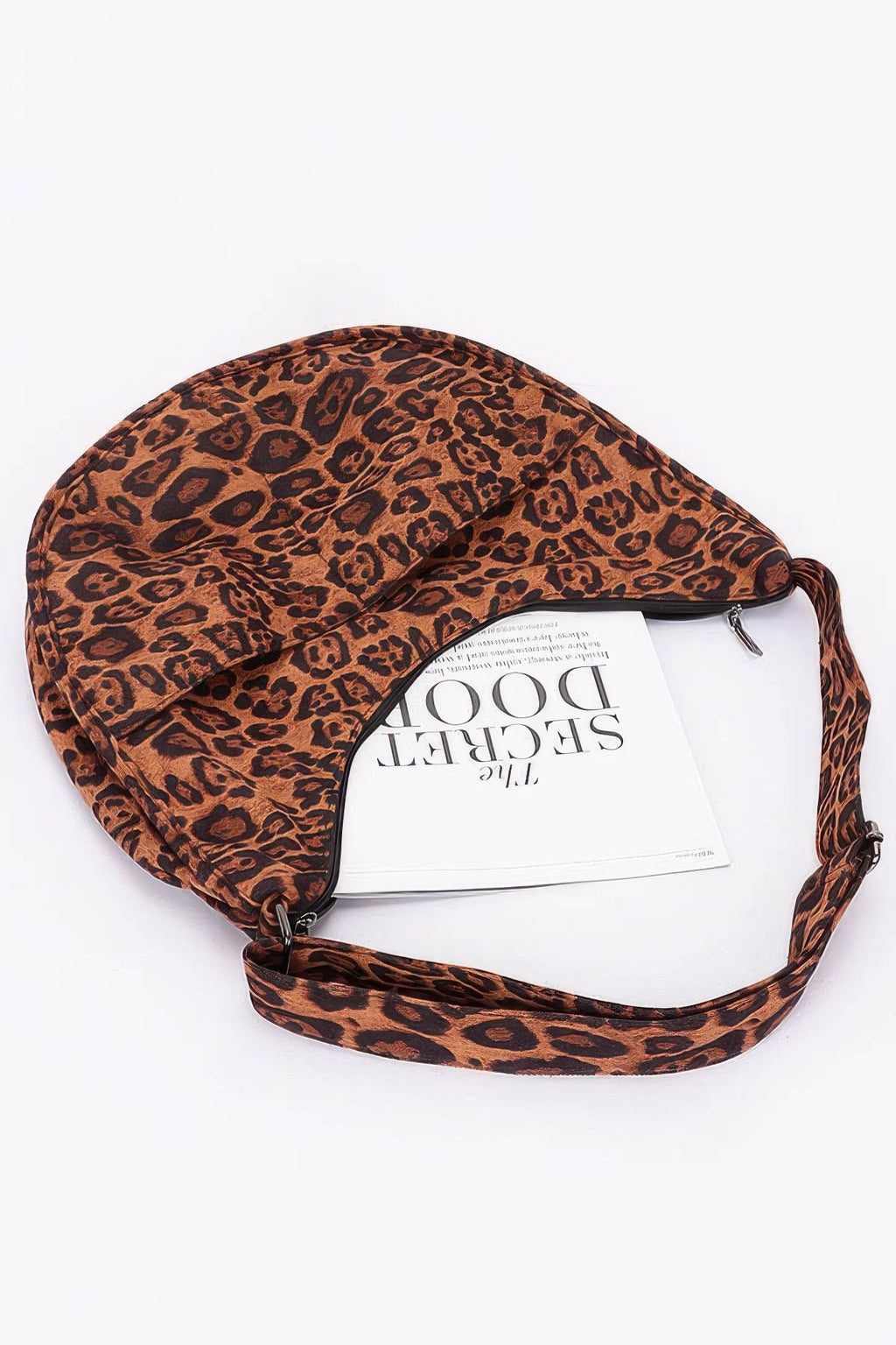 Leopard faux suede crossbody bag with zip closure and hanging strap loop