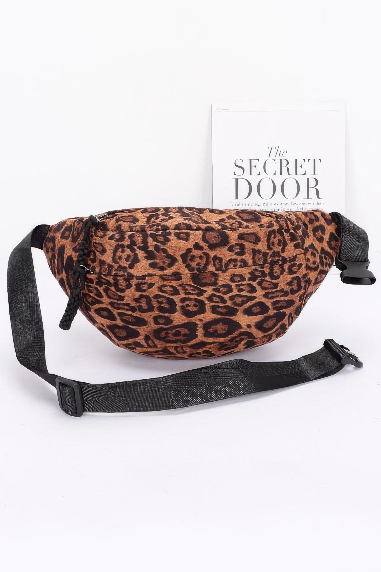 Leopard faux suede crossbody bag with black crossbody strap and drawstring top