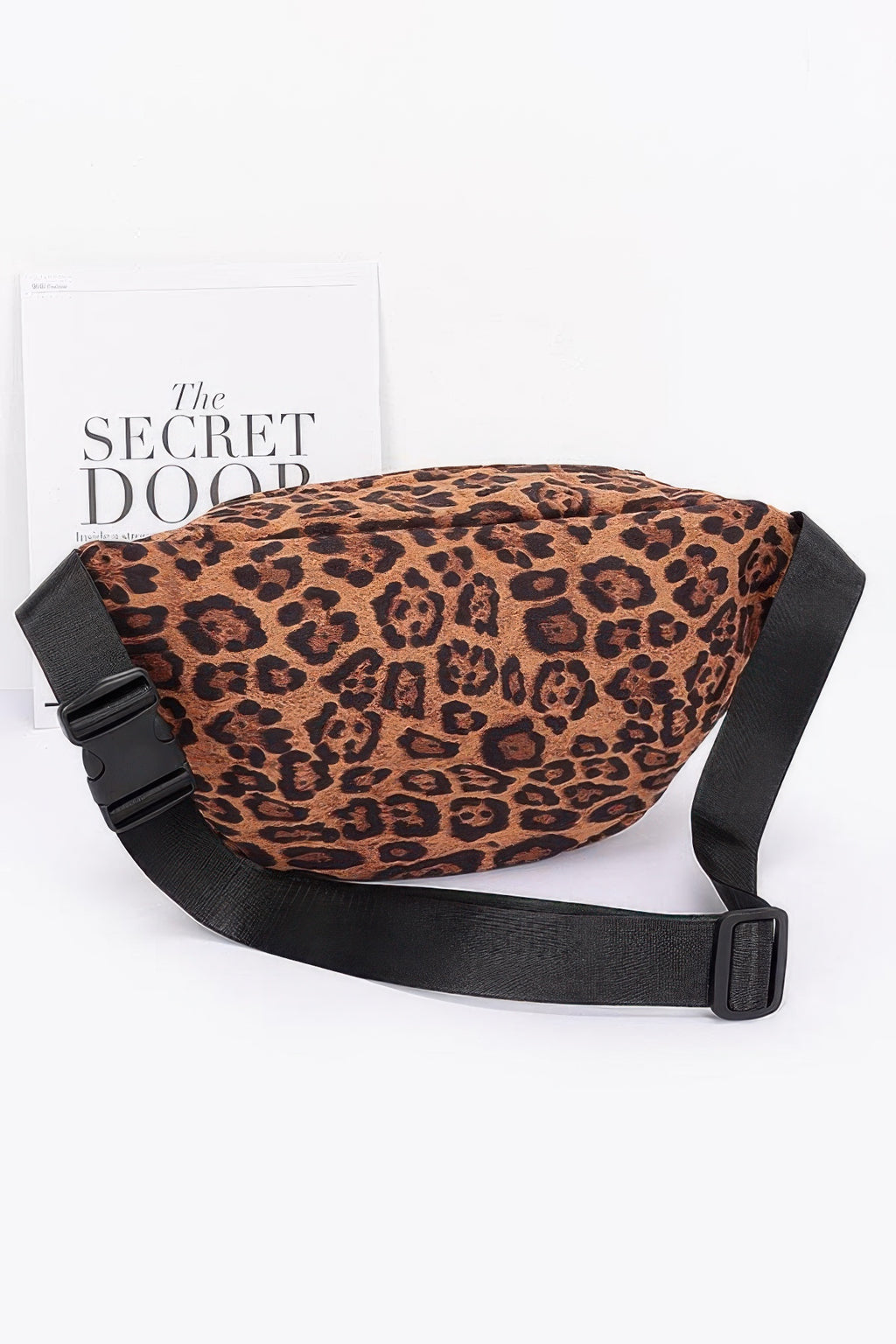 Leopard faux suede crossbody bag with black strap buckles and drawstring closure
