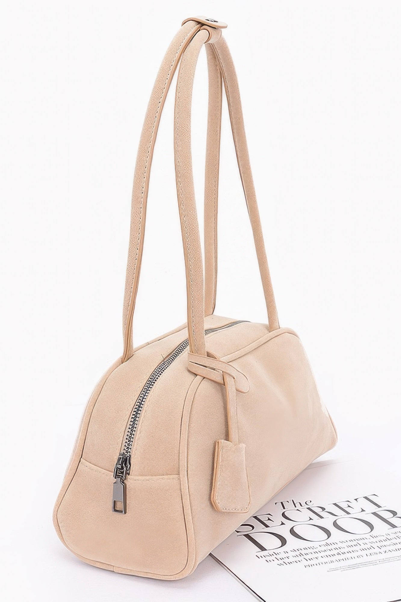 Beige faux suede sport bag with zip front and long shoulder straps