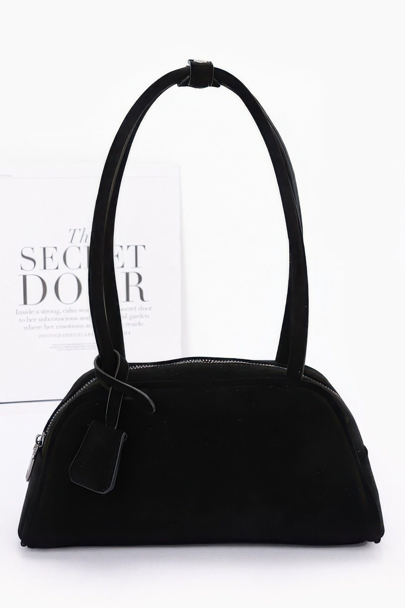 Black faux suede sport bag with top handles and front zipper pocket