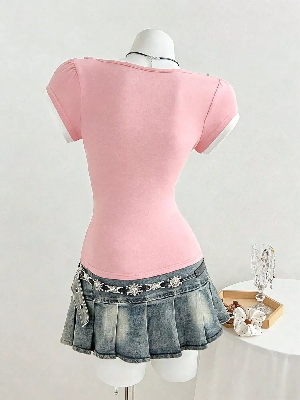 Pink slim fit T-shirt back view with short cap sleeves, smooth plain design