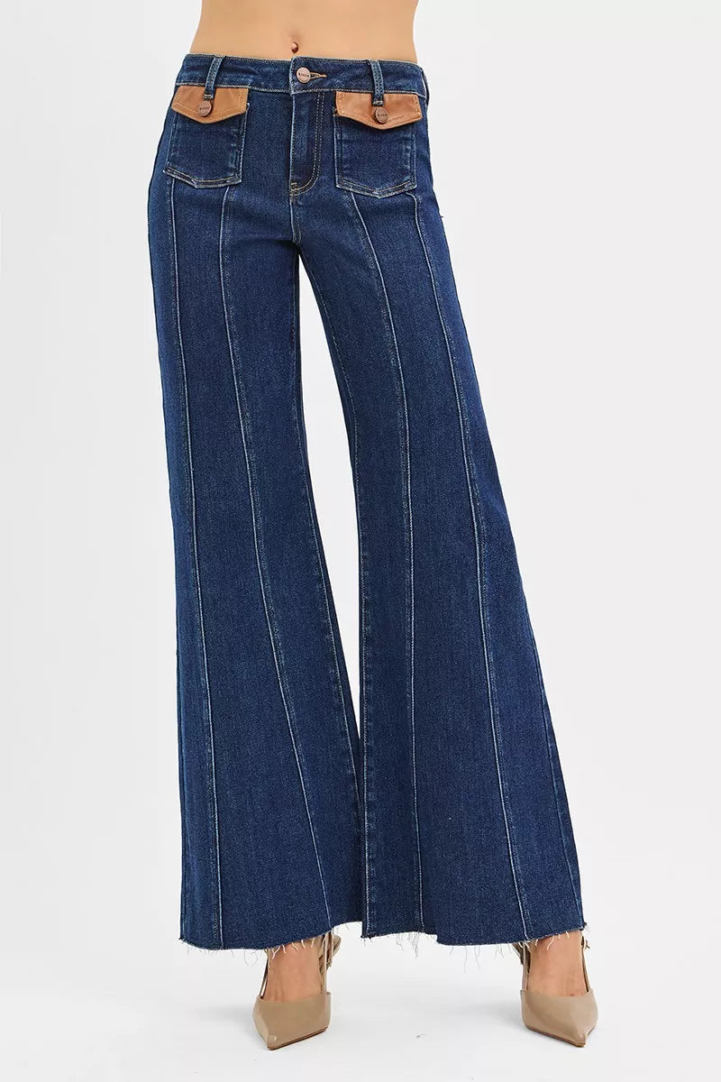 High-rise wide flare jeans with front leather pocket tabs, dark denim