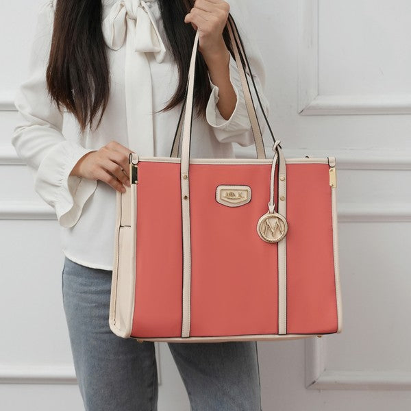 Coral and cream oversized tote with front logo patch, vertical stripe panels, hanging M charm