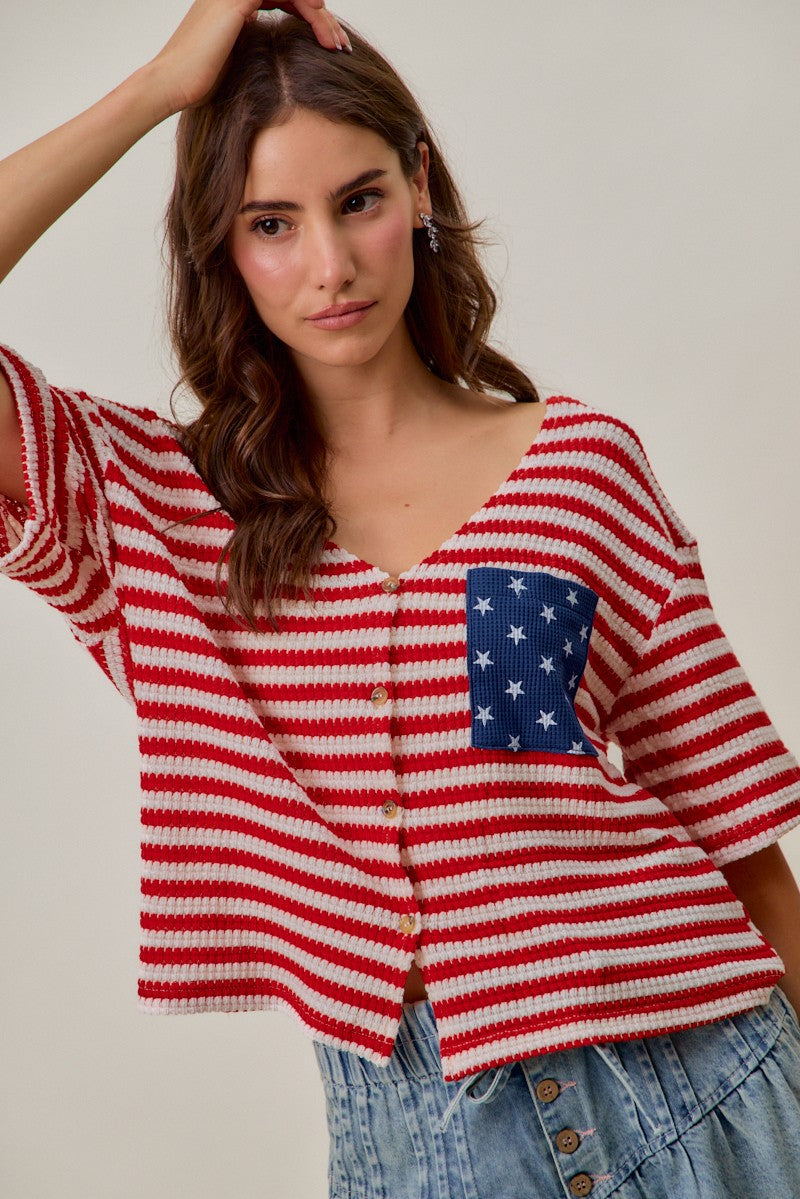 Red-and-ivory striped cardigan with blue star patch pocket and button front placket