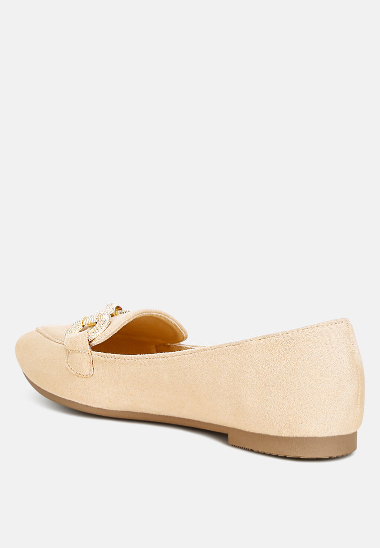 Beige pointed-toe flat loafer, rear view showing horsebit strap detail