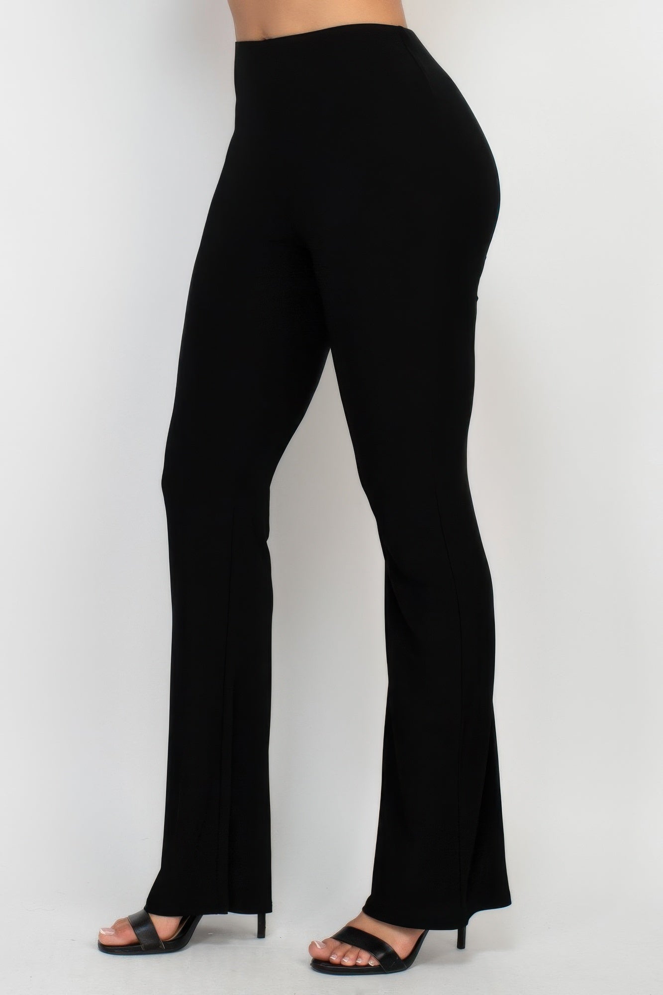 Black fit-and-flare pants side view, wide flare leg opening at hem