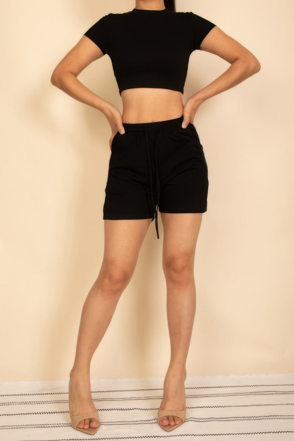 Black fitted crop tee and drawstring shorts set—tie-waist shorts, back view