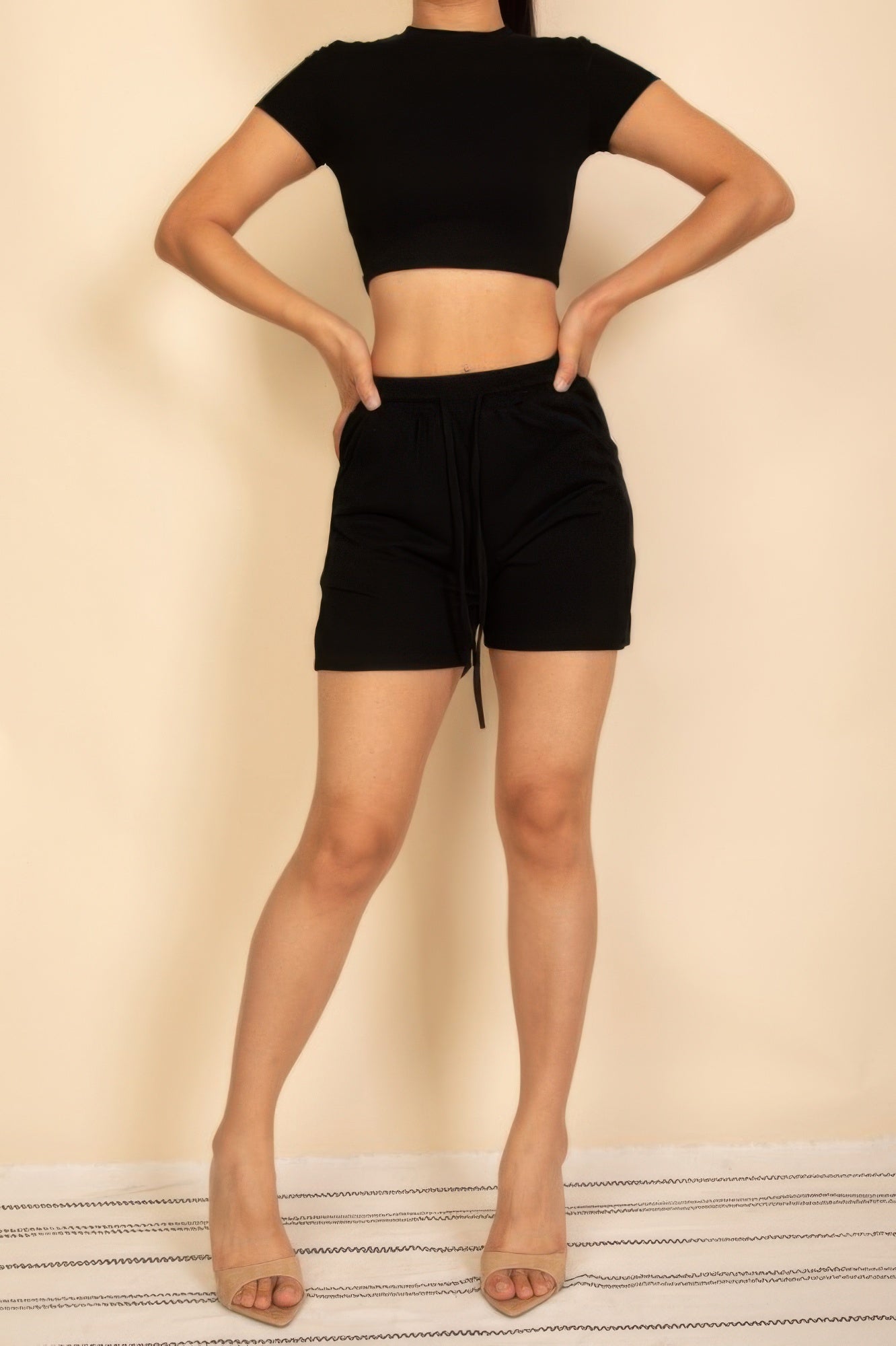 Black fitted crop tee and drawstring shorts set—tie-waist shorts, back view