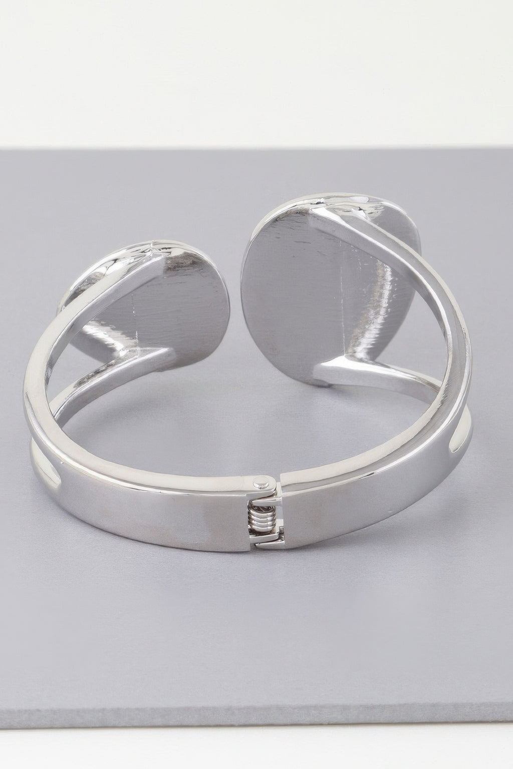Silver flat disc wrap bracelet with spring clasp and curved cuff