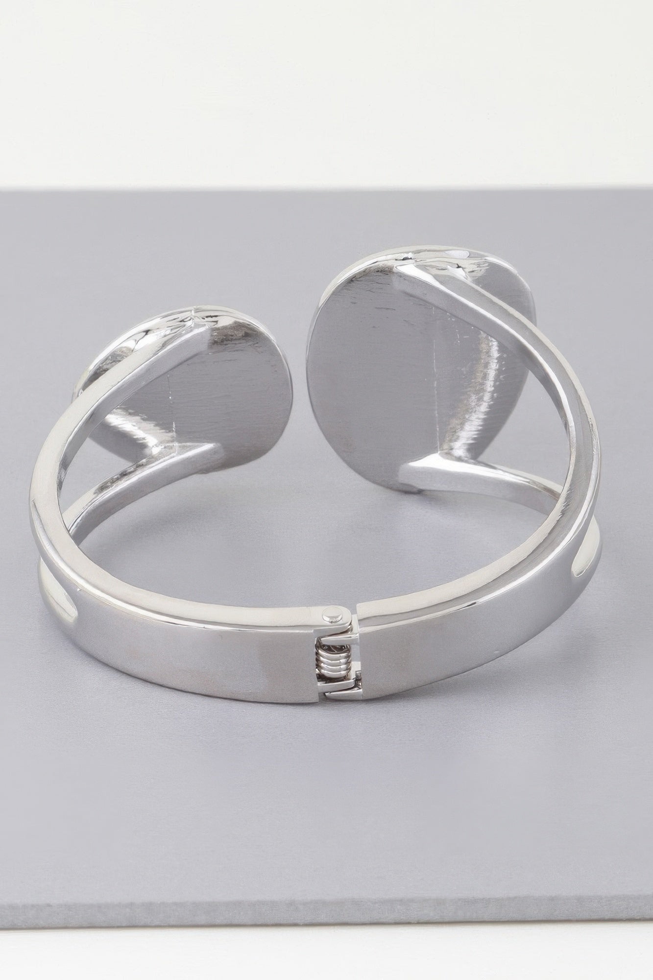 Silver flat disc wrap bracelet with spring clasp and curved cuff
