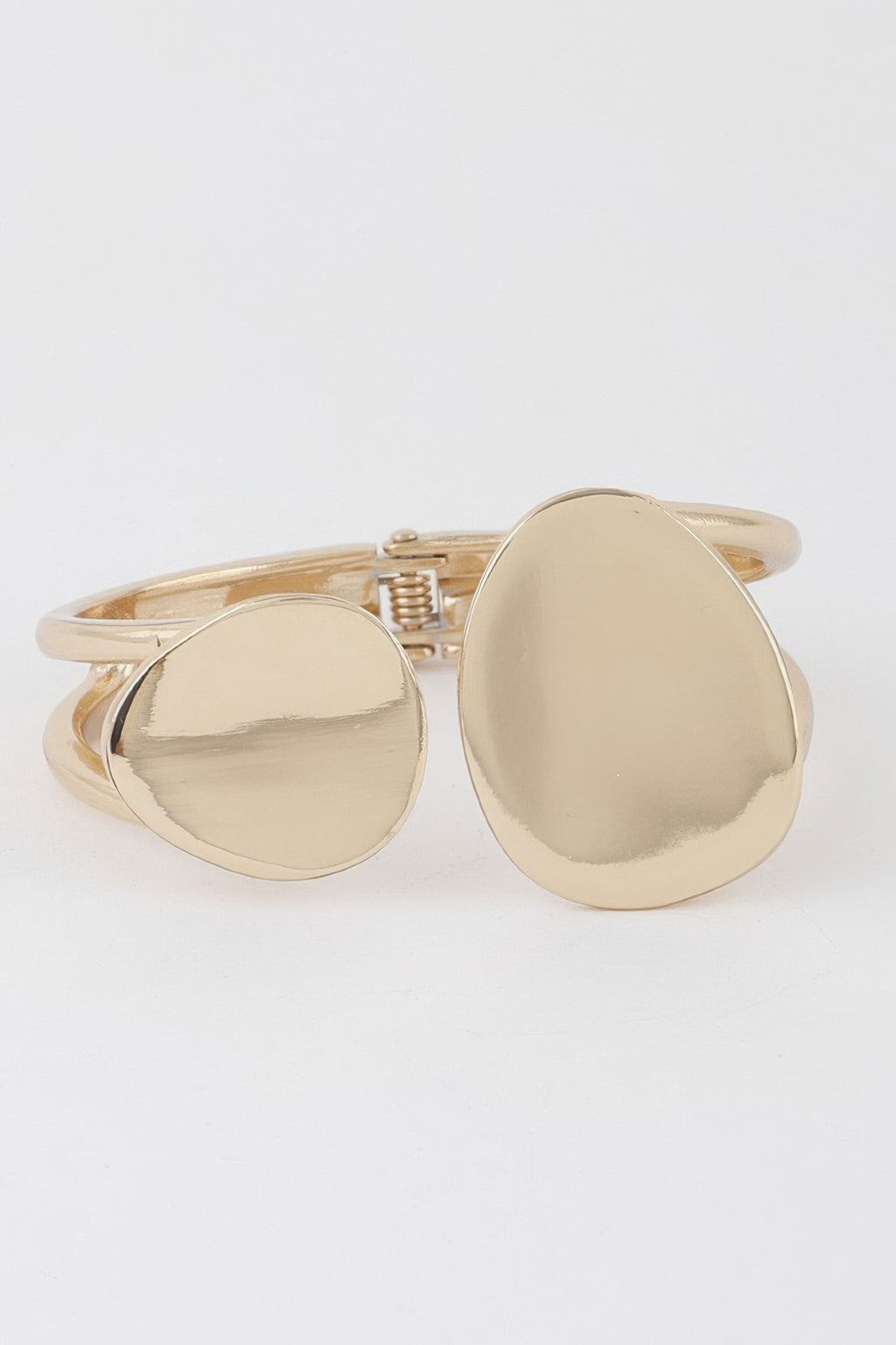 Gold flat stone wrap bracelet with two round discs on adjustable cuff