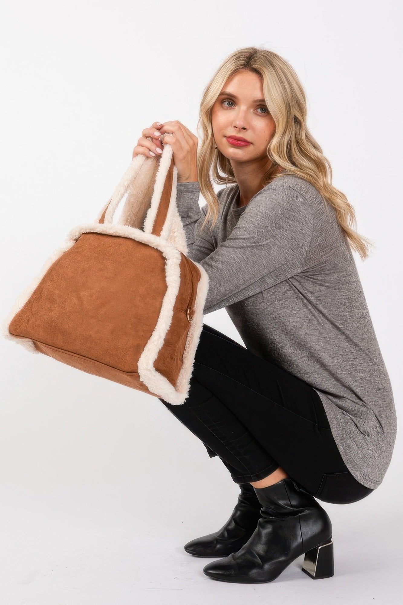 Camel tote and crossbody bag with white fleece trim and gold-tone zipper pull