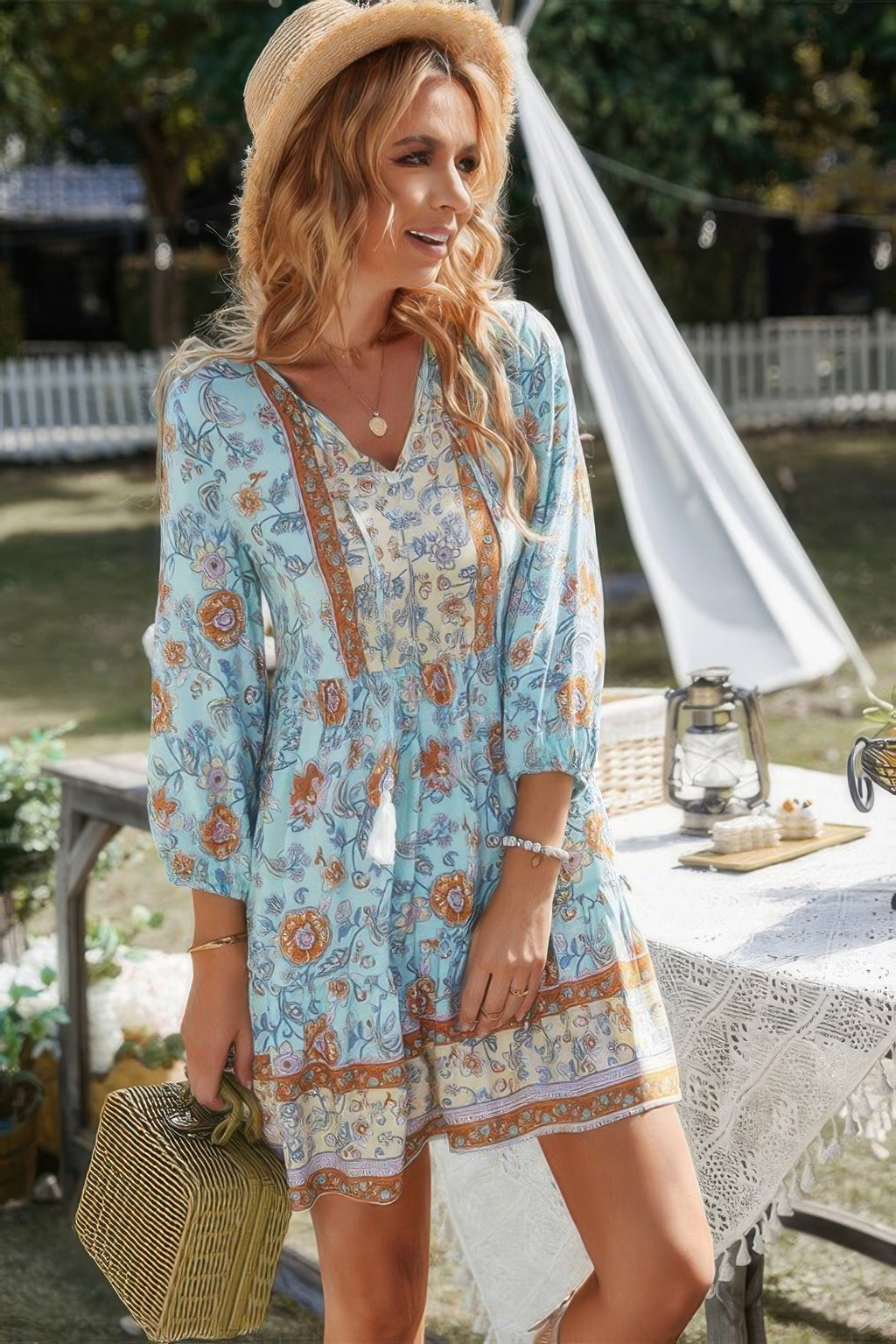 Blue floral V-neck long-sleeve dress with button front and tiered skirt