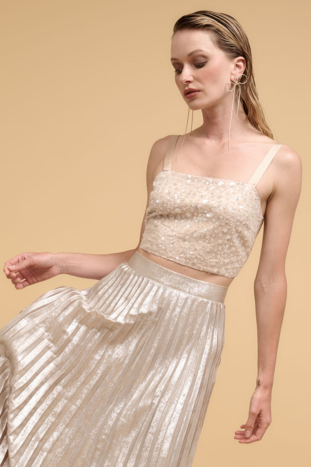 Champagne sequin straight-neck crop top, floral sparkle pattern, angled side view