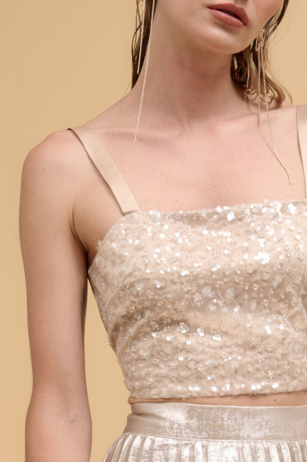 Close-up of champagne floral sequin straight-neck crop top front with thin straps