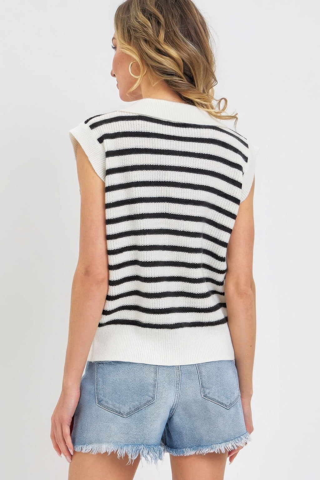 Back view of ivory-and-black striped knit top with ribbed knit and sleeveless cut