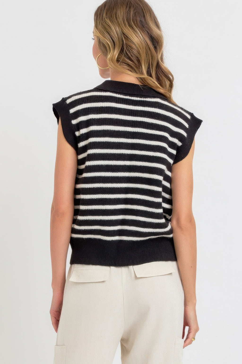 Black-and-ivory striped knit top, back view, ribbed collar, short cap sleeves