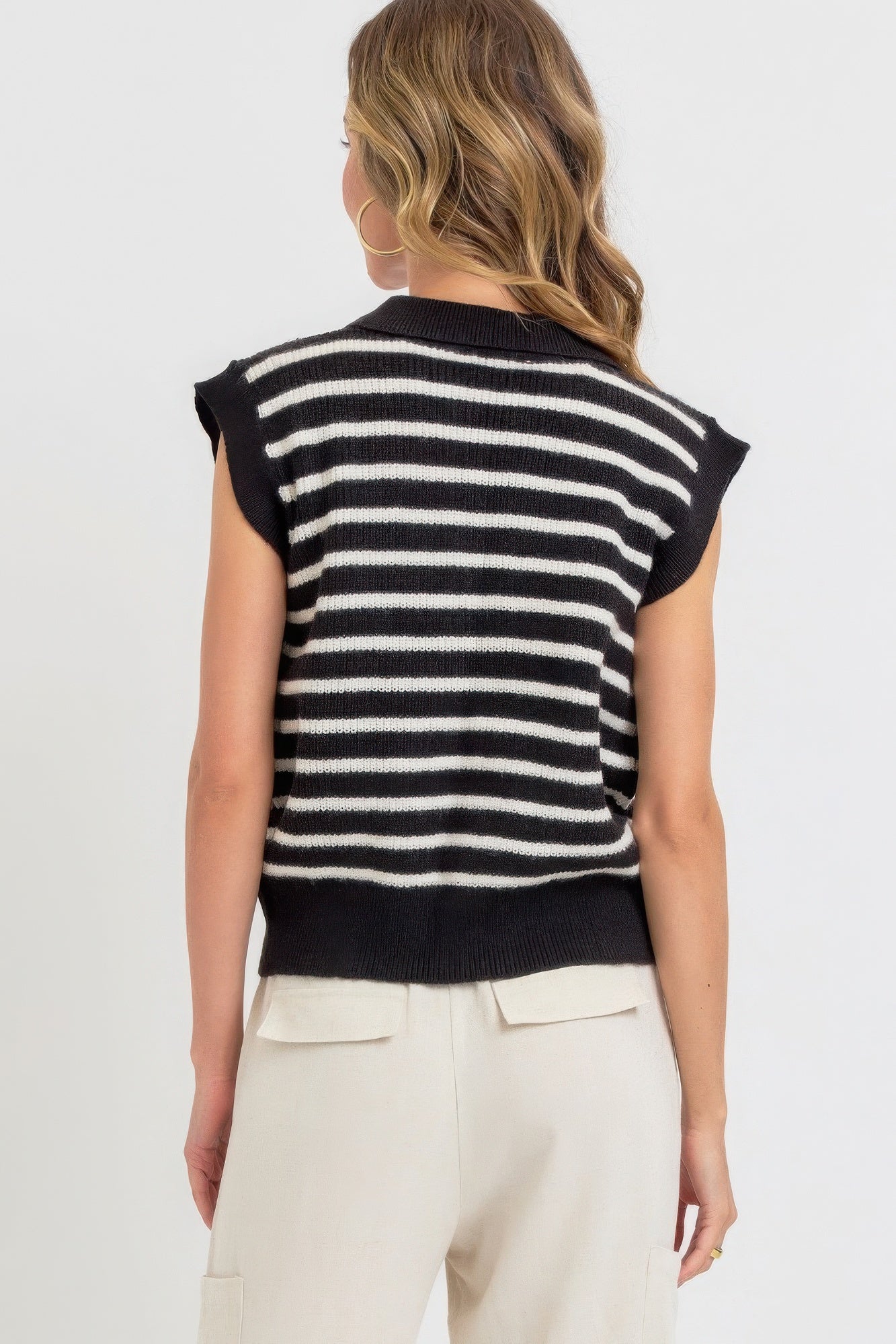 Black-and-ivory striped knit top, back view, ribbed collar, short cap sleeves