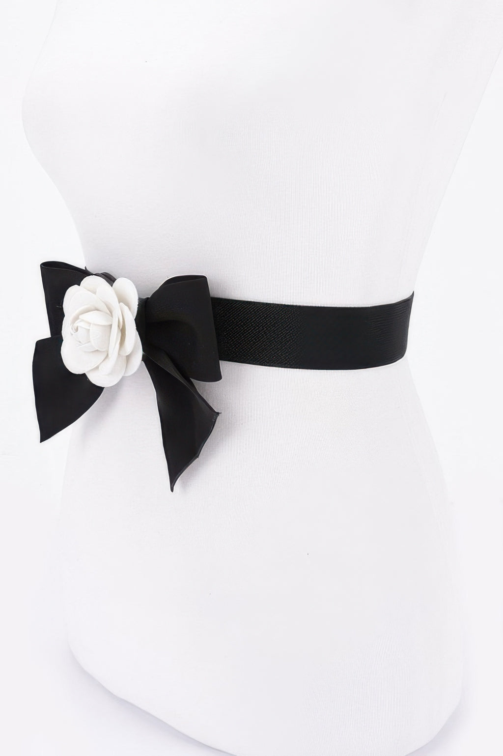 Black elastic ribbon belt with white flower rosette and bow on one side