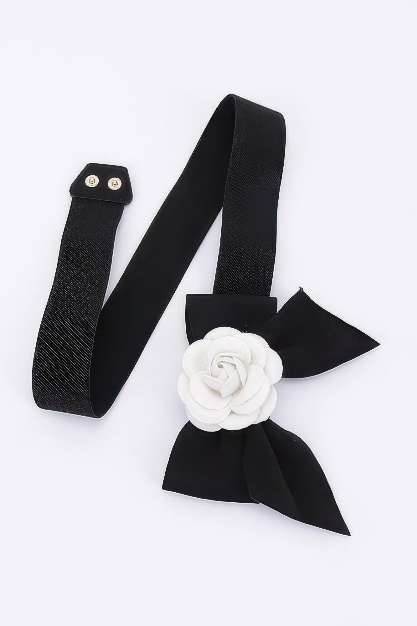 Black elastic belt with white flower rosette and long ribbon tails