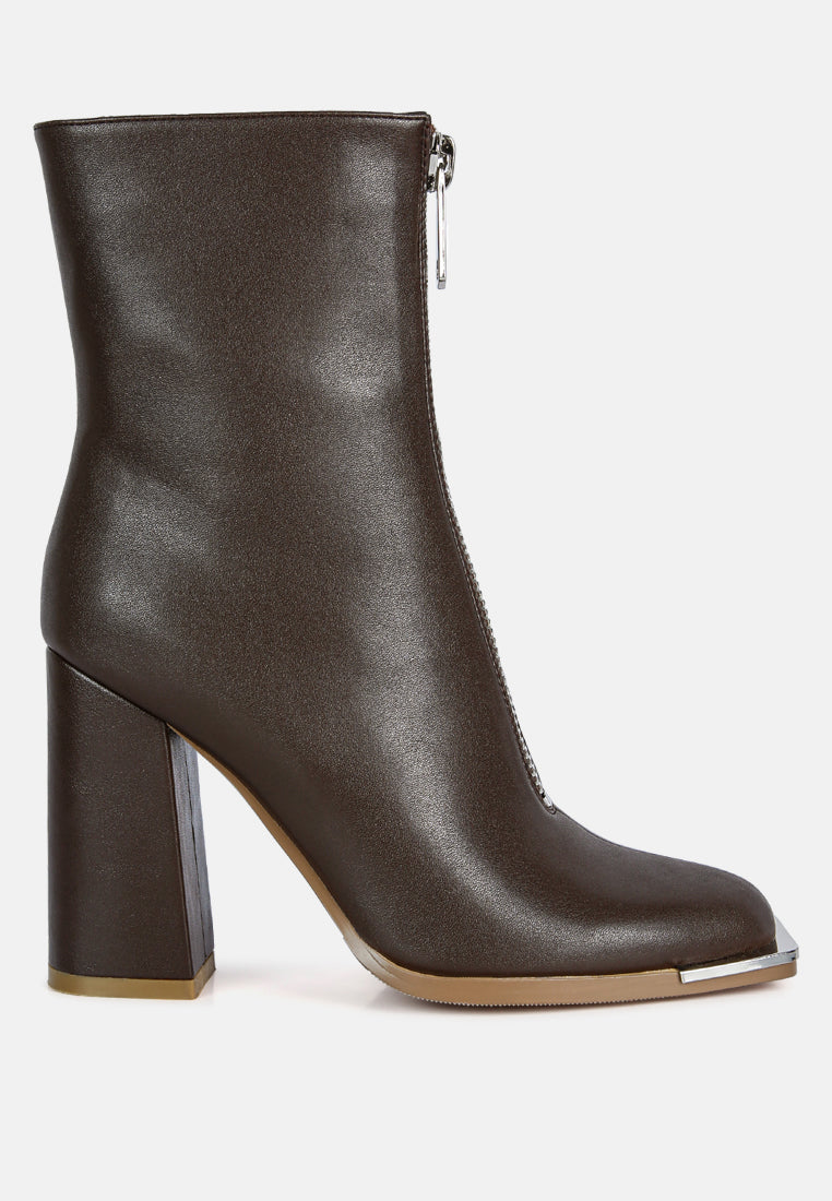 Brown leather ankle boot with a block heel on a white background