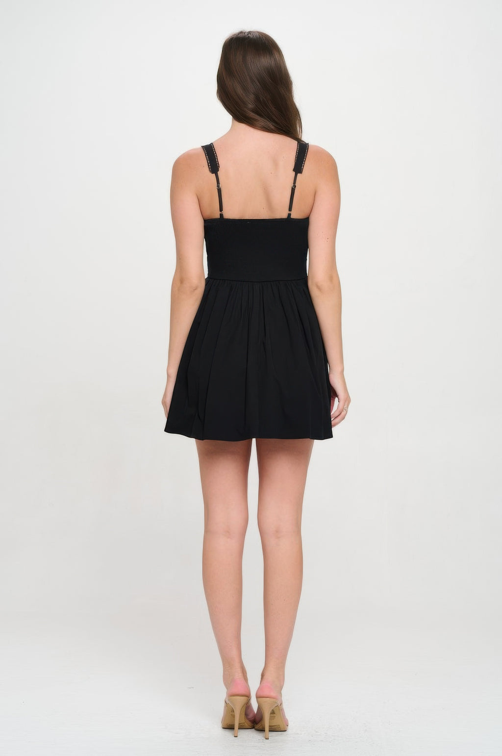 Rückansicht: Schwarzes Bustierkleid mit schmalen Trägern und gerafftem Faltenrock