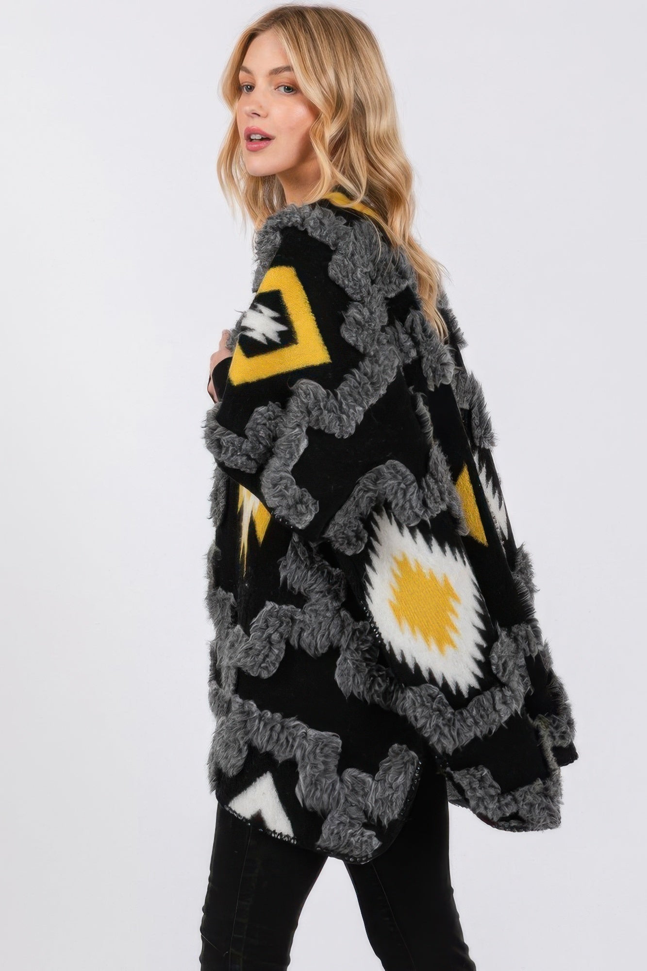 Black fuzzy kimono with Aztec pattern on the sleeve and front panel