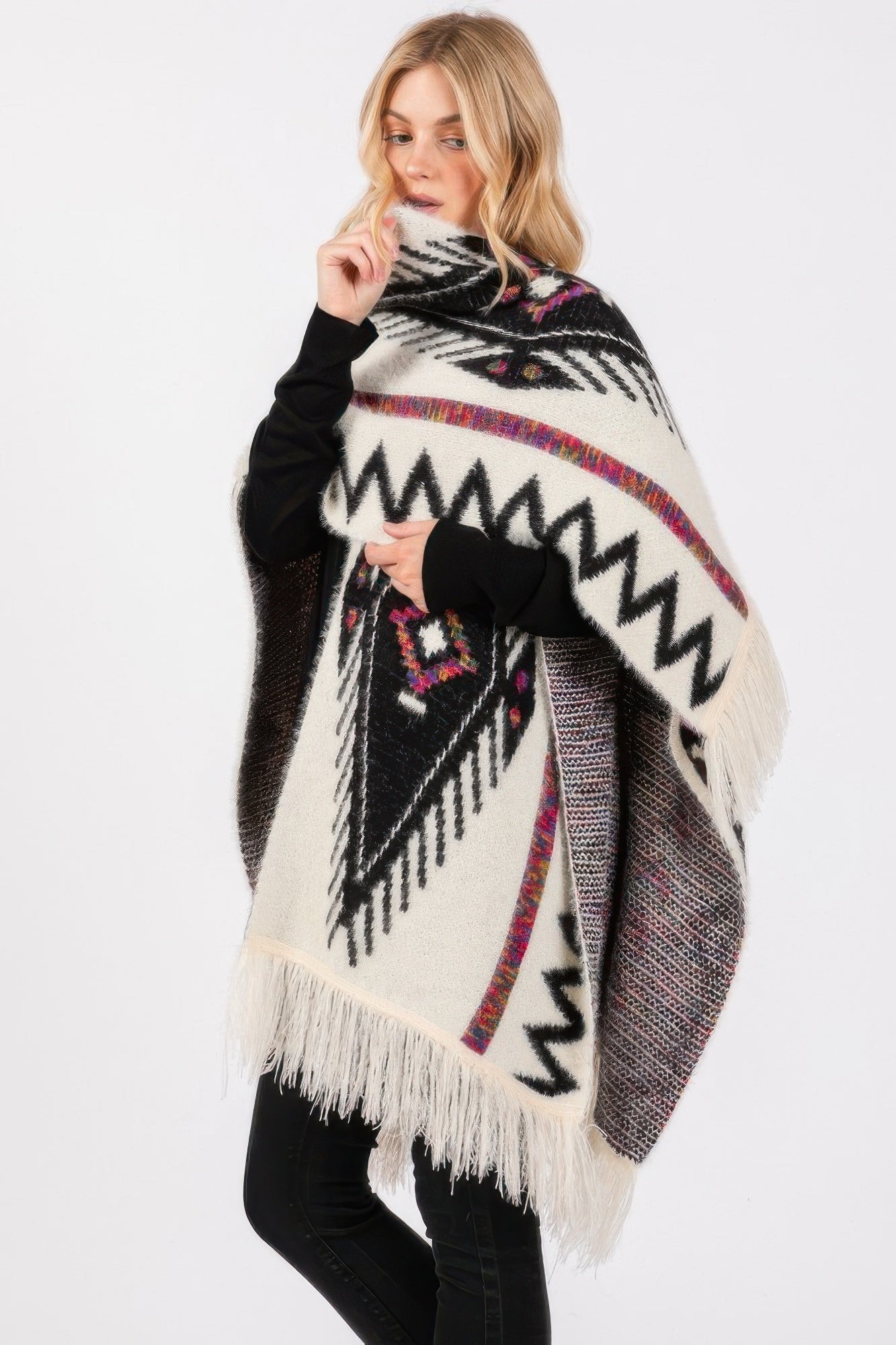 Aztec knit ruana with zigzag motifs and multicolor accents, ivory-and-black fringe trim