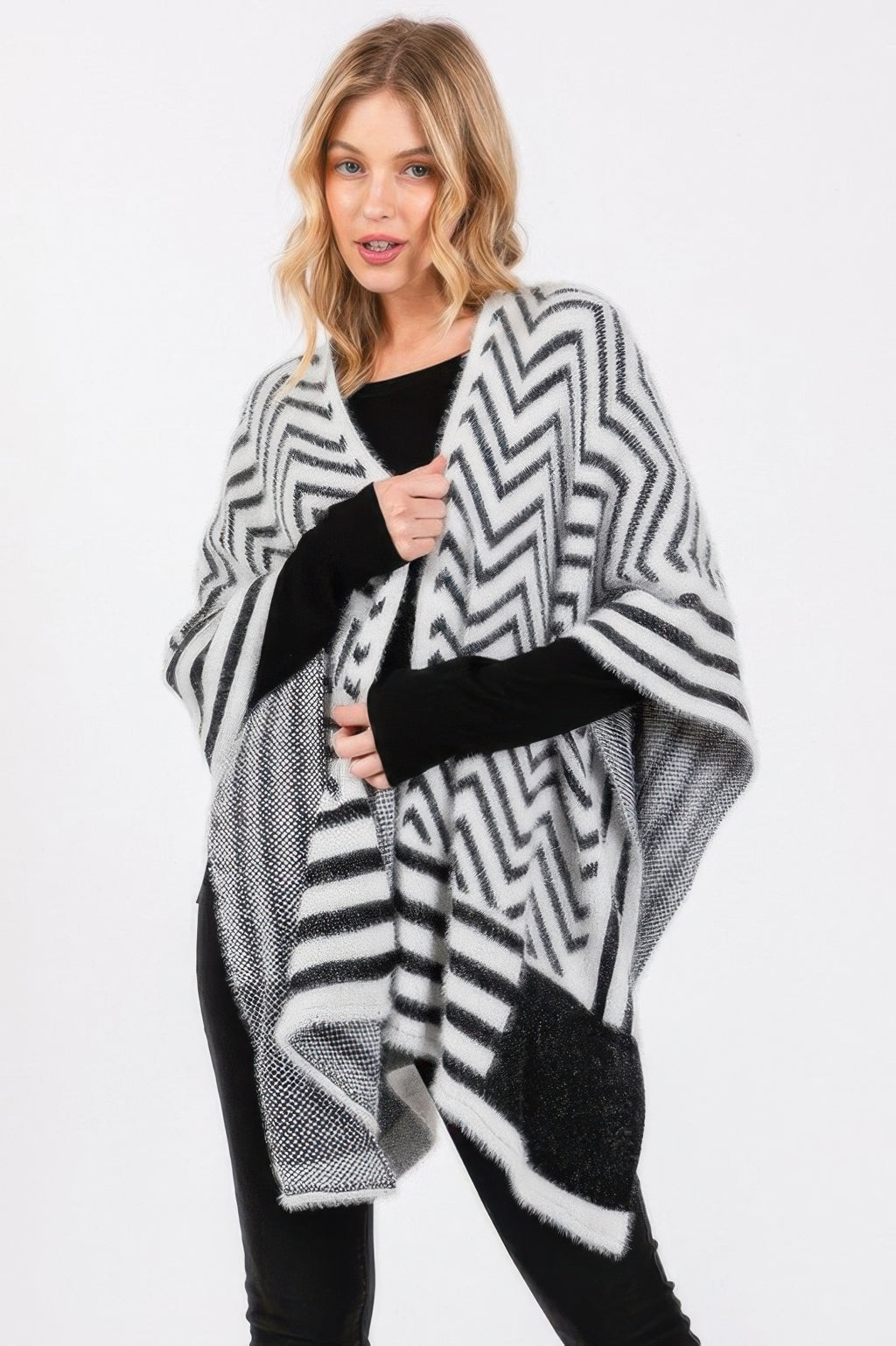 Fuzzy chevron ruana in ivory with black zigzag pattern and soft fringe hem