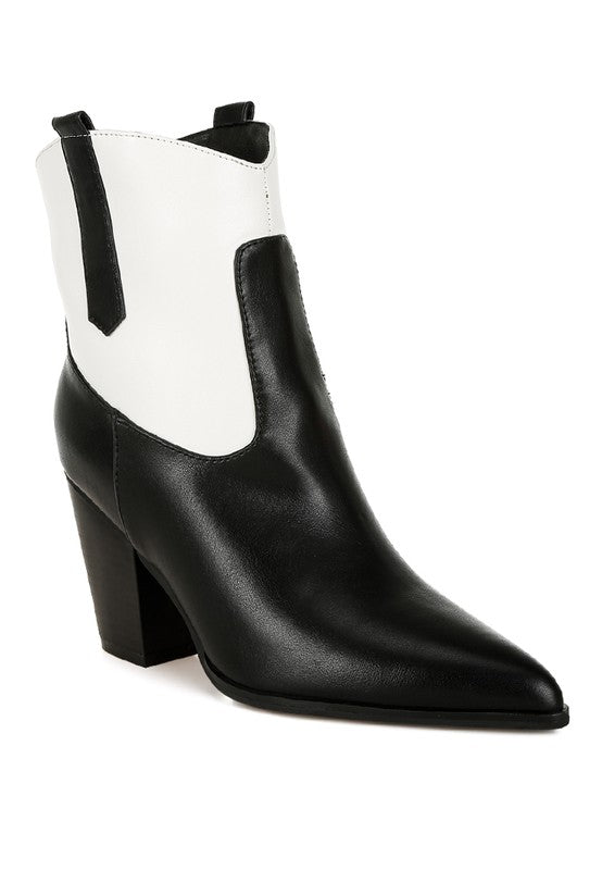 Black and white chelsea-style cowboy boots with tall ankle shaft and chunky heel